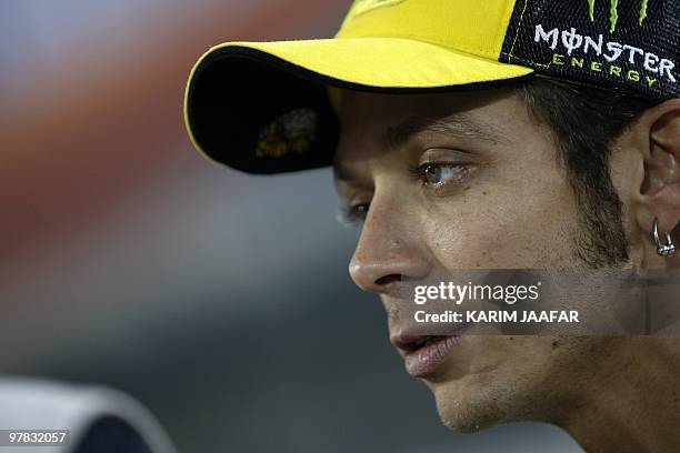 Italy's MotoGP rider Valentino Rossi of Fiat Yamaha Team waits for the start of the final pre-season test at the Losail International Circuit in the...