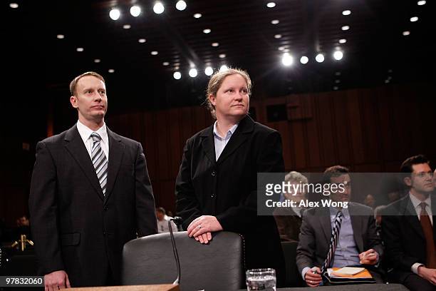 Former US Air Force Major Michael Almy ; and former US Navy Lieutenant Junior Grade Jenny Kopfstein wait for the beginning of a hearing before the...