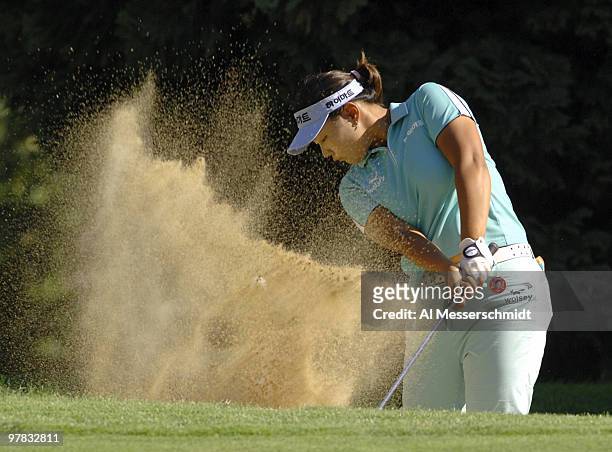 First-round leader Jee Young Lee blasts from a bunker on the fourth hole at Columbia-Edgewater Country Club during the second round of the Safeway...