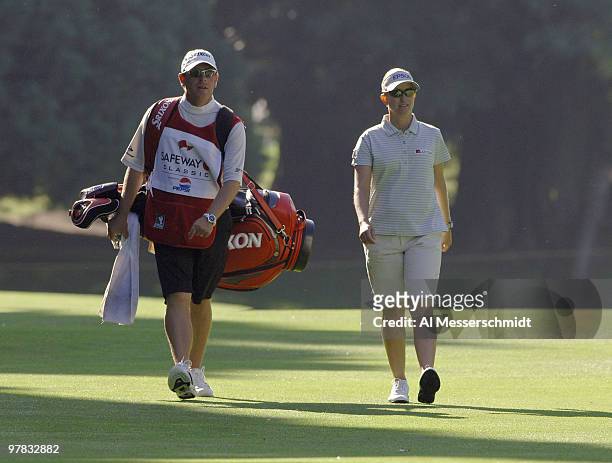 Karrie Webb walks the fourth fairway in early-morning light during the final round of the Safeway Classic at Columbia-Edgewater Country Club in...