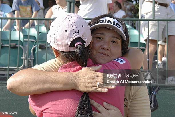Winner Pat Hurst hugs runner-up Jeong Jang on the 18th green after the final round of the Safeway Classic at Columbia-Edgewater Country Club in...