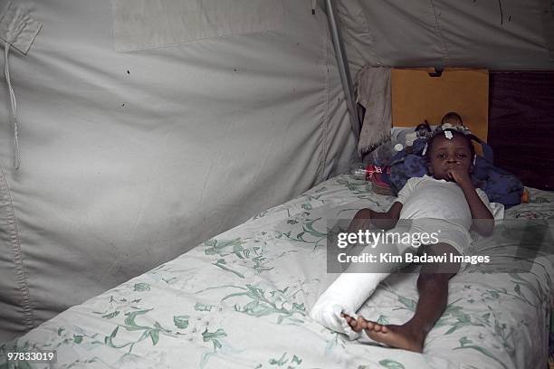 Mirliane Pierre, earthquake survivor, at the Red Cross medical observation tent inside General Hospital on February 8, 2010 in Port-au-Prince, Haiti....