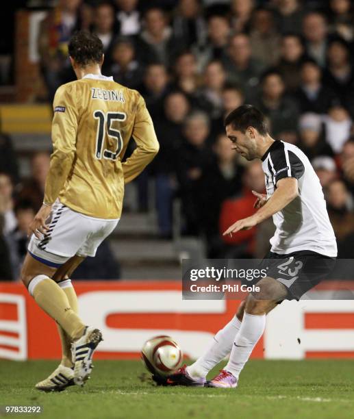 Clint Dempsey of Fulham shoots to score during the UEFA Europa League Round of 16 second leg match between Fulham and Juventus at Craven Cottage on...