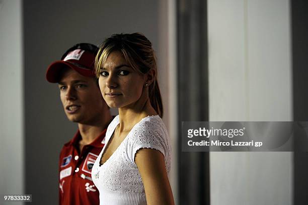 Casey Stoner of Australia and Ducati Marlboro Team and his wife Adriana Stoner of Australia look on during the second day of testing at Losail...