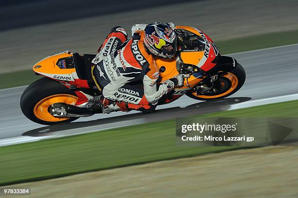 Andrea Dovizioso of Italy and Repsol Honda Team heads down a straight during the second day of testing at Losail Circuit on March 18, 2010 in Doha,...