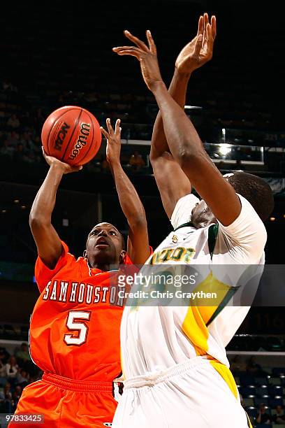 Drae Murray of the Sam Houston State Bearkats shoots the ball over Ekpe Udoh of the Baylor Bears during the first round of the 2010 NCAA men's...