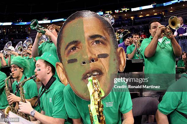 Member of the North Texas Mean Green wears a mask with the likeness of U.S. President Barack Obama as they perform against the Kansas State Wildcats...