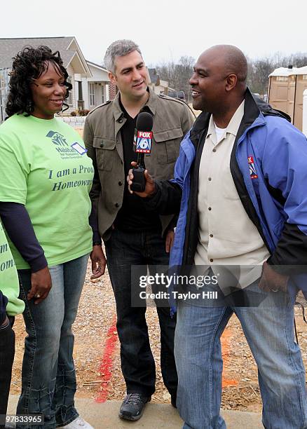 Taylor Hicks and Jeh Jeh Pruitt lend a hand to Habitat For Humanity on March 18, 2010 in Birmingham, Alabama.