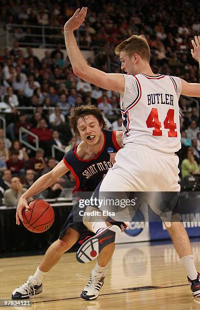 Matthew Dellavedova of the Saint Mary's Gaels tries to get around Ryan Butler of the Richmond Spiders during the first round of the 2010 NCAA men's...