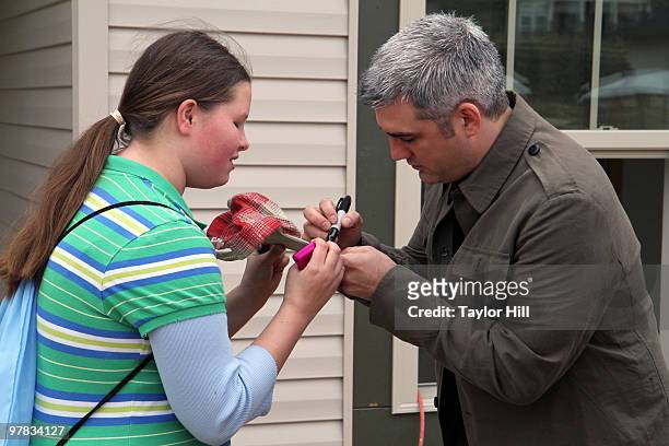 Taylor Hicks signs autographs while helping Habitat For Humanity on March 18, 2010 in Birmingham, Alabama.
