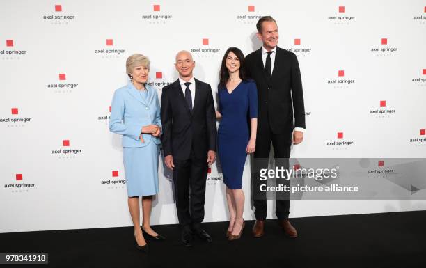 April 2018, Germany, Berlin: Friede Springer , main shareholder of the publishing house Axel Springer, Amazon founder Jeff Bezos, his wife MacKenzie...
