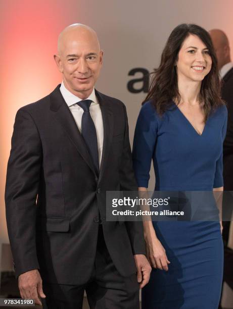 April 2018, Germany, Berlin: Head of Amazon Jeff Bezos and his wife MacKenzie Bezos arrive for the Axel Springer award ceremony. Bezos is receiving...