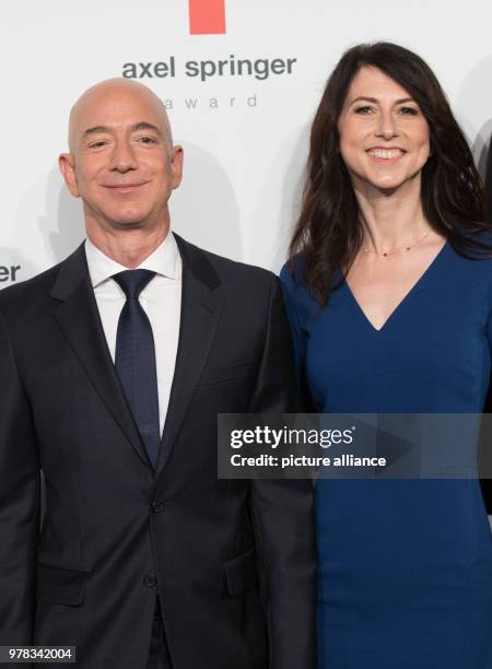 April 2018, Germany, Berlin: Head of Amazon Jeff Bezos and his wife MacKenzie Bezos arrive for the Axel Springer award ceremony. Bezos will be...