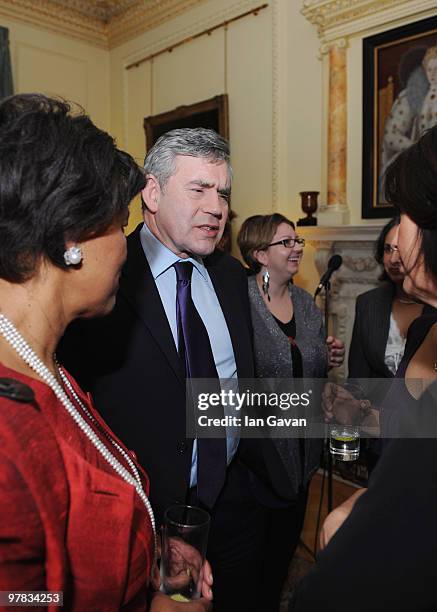Prime Minister Gordon Brown greets guests including Baroness Scotland of Asthal at a reception In Aid Of Women's Day at 10 Downing Street on March...