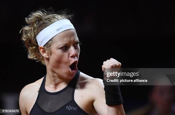 April 2018, Germany, Stuttgart: Tennis: WTA-Tour - Stuttgart, singles, women. Laura Siegemund of Germany clenches her fist in a celebratory gesture...