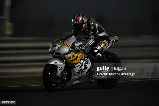 Hiroshi Aoyama of Japan and Interwetten MotoGP Team heads down a straight during the second day of testing at Losail Circuit on March 18, 2010 in...