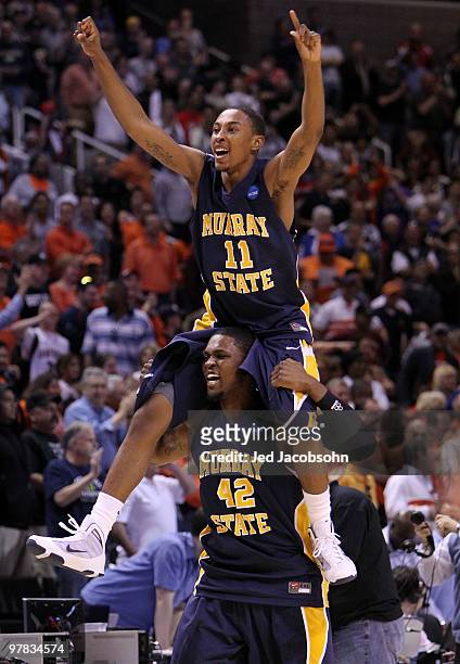 Guard Donte Poole and forward Ivan Aska of the Murray State Racers react after defeating the Vanderbilt Commodores 66-65 in the first round of the...