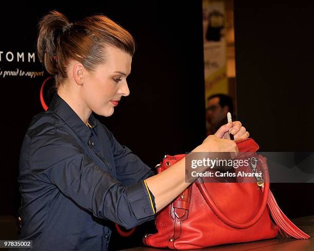 Actress Milla Jovovich presents the Tommy Hilfiger limited edition Bag at the El Corte Ingles store on March 18, 2010 in Madrid, Spain.