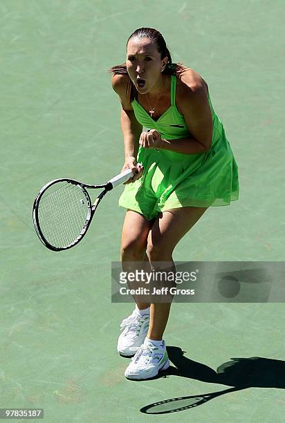 Jelena Jankovic of Serbia celebrates following her victory over Alisa Kleybanova of Russia during the BNP Paribas Open at the Indian Wells Tennis...