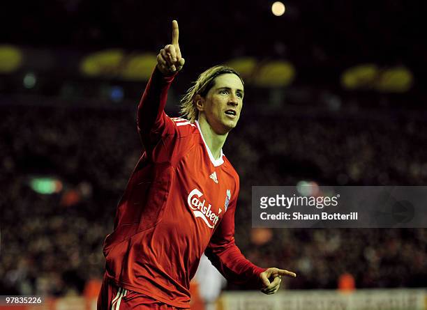 Fernando Torres of Liverpool celebrates scoring his team's second goal during the UEFA Europa League Round of 16, second leg match at Anfield on...