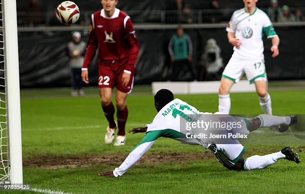 Obafemi Martins of Wolfsburg scores his team's first goal during the UEFA Europa League round of 16 second leg match between VfL Wolfsburg and Rubin...