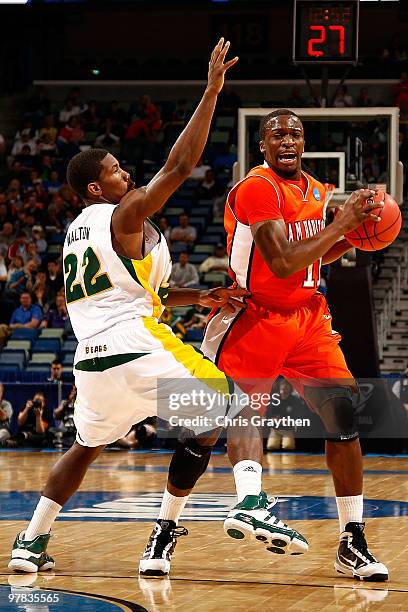 Josten Crow of the Sam Houston State Bearkats looks to pass the ball around A.J. Walton of the Baylor Bears during the first round of the 2010 NCAA...