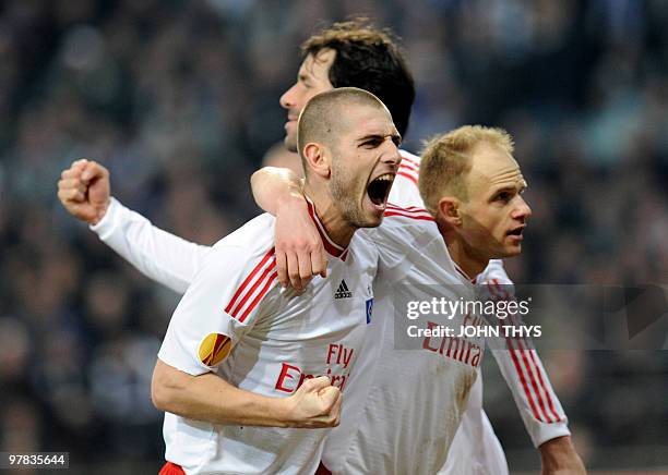 Hamburg's Croatian striker Mladen Petric celebrates scoring a goal during the UEFA Europa League football match against Anderlecht on March 18, 2010...