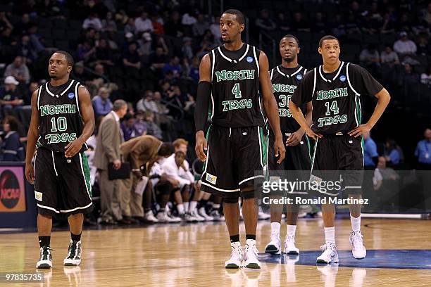 Josh White, George Odufuwa, Jacob Holmen and Tristan Thompson of the North Texas Mean Green look on dejected against the Kansas State Wildcats during...