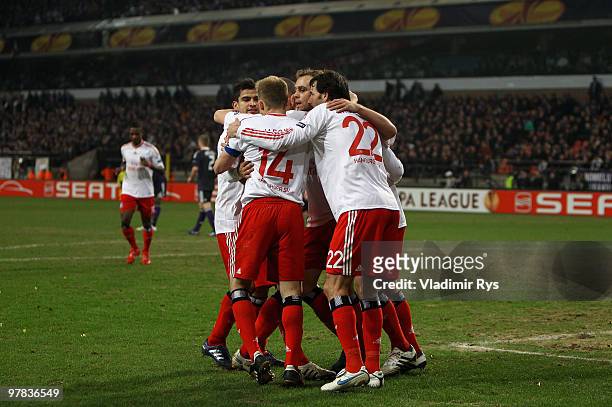 Mladen Petric of Hamburg is celebrated after scoring his team's third goal during the UEFA Europa League round of 16 second leg match between RSC...