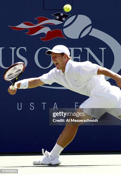 Yevgeny Kafelnikov of Russia stretches for a forehand Sunday, August 31, 2003 at the U. S. Open in New York. Kafelnikov lost in straight sets to...