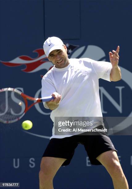 Andre Agassi, U. S. A., returns a forehand Sunday, August 31, 2003 at the U. S. Open in New York. Agassi, the top seed in the tournament, defeated...