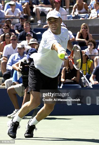 Andre Agassi, U. S. A., returns a backhand Sunday, August 31, 2003 at the U. S. Open in New York. Agassi, the top seed in the tournament, defeated...