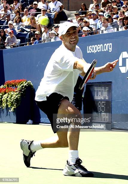 Andre Agassi, U. S. A., returns a background Sunday, August 31, 2003 at the U. S. Open in New York. Agassi, the top seed in the tournament, defeated...