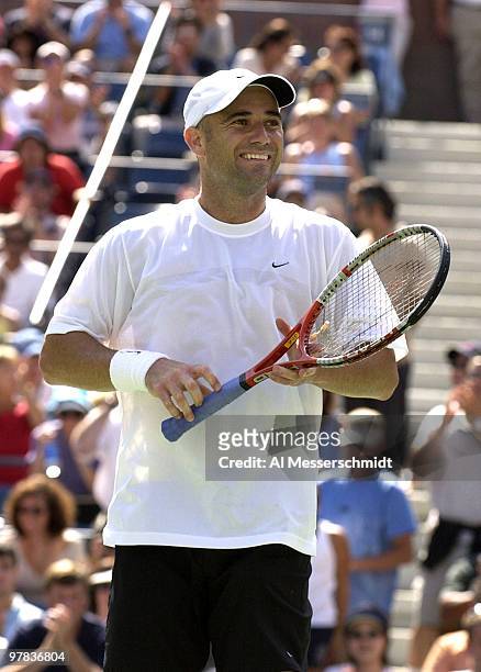 Andre Agassi, U. S. A., smiles at the crowd after the final point Sunday, August 31, 2003 at the U. S. Open in New York. Agassi, the top seed in the...