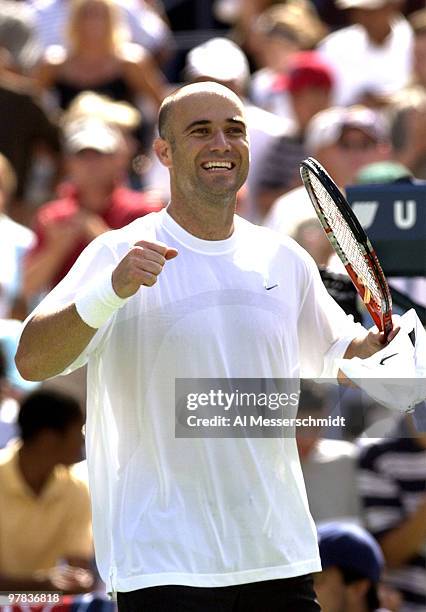 Andre Agassi, U. S. A., smiles at the crowd after the final point Sunday, August 31, 2003 at the U. S. Open in New York. Agassi, the top seed in the...