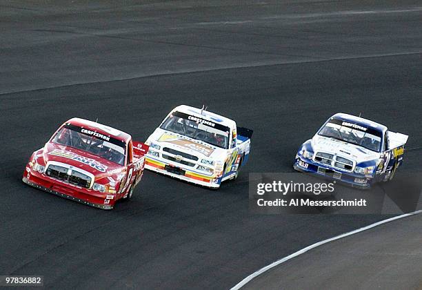 Bill Lester leads the pack into the fourth turn at the NASCAR Craftsman Truck Series Ford 200 race Friday, November 14, 2003 at Homestead-Miami...