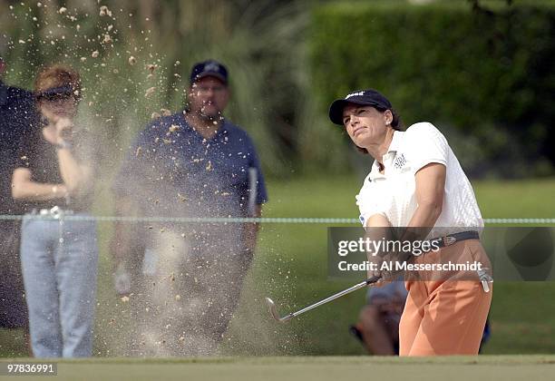 Julie Inkster blasts from the sand on the first hole Sunday, October 12, 2003 at the Samsung World Championship in Houston, Texas.