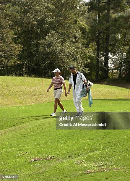 Sophie Gustafson and her caddy walk the fairway on the 13th hole Sunday, October 12, 2003 at the Samsung World Championship in Houston, Texas....