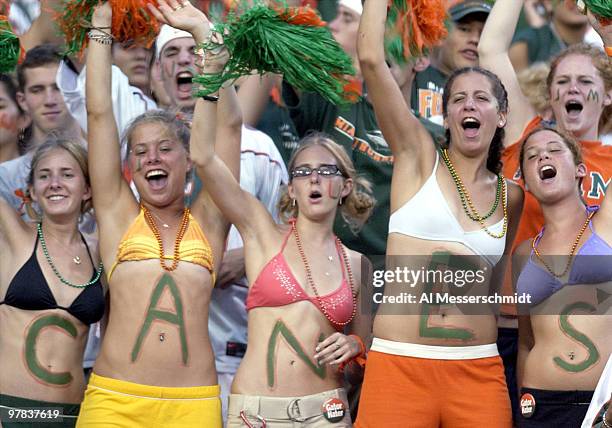 University of Miami coeds celebrate a come-from-behind victory September 6, 2003 at the Orange Bowl in Miami. Miami defeated the University of...