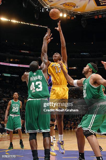 Andrew Bynum of the Los Angeles Lakers shoots over Kendrick Perkins and Rasheed Wallace of the Boston Celtics during the game at Staples Center on...