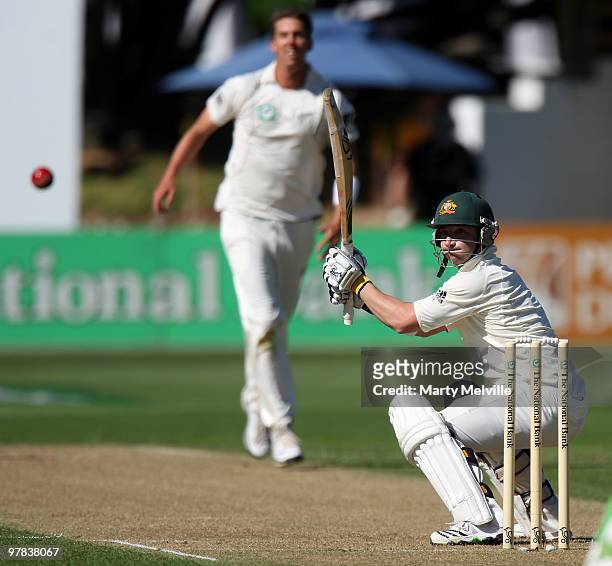 Phillip Hughes of Australia edges one to Ross Taylor of New Zealand during day one of the First Test match between New Zealand and Australia at...