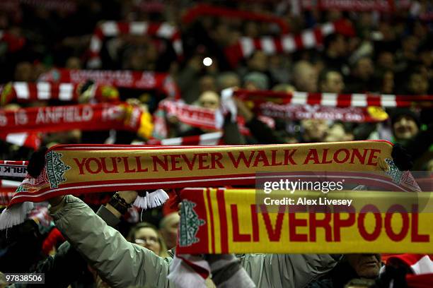 Liverpool fans on the Kop show their support with their scarves during the Barclays Premier League match between Liverpool and Portsmouth at Anfield...