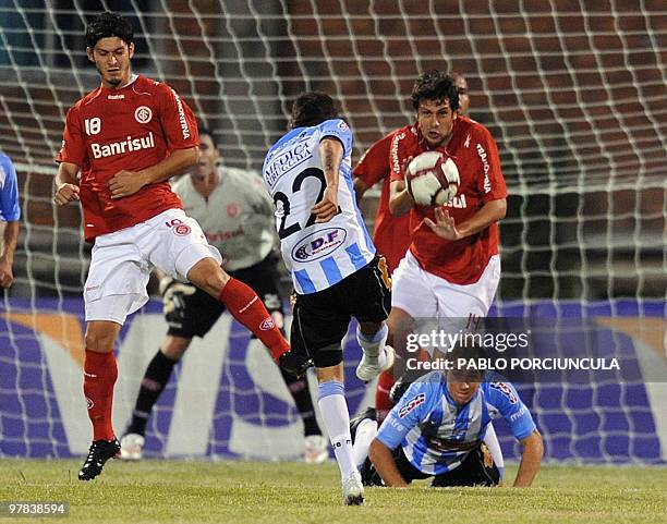 Uruguayan Cerro's Pablo Caballero shoots the ball during the Copa Libertadores football match against Brazilian Internacional at Atilio Paiva Olivera...