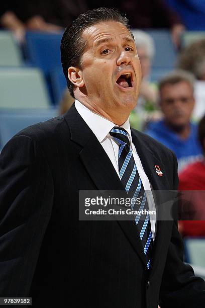 Head coach John Calipari of the Kentucky Wildcats talks with his team during a timeout against the East Tennessee State Buccaneers during the first...