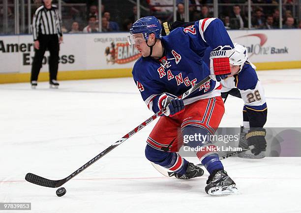 Ryan Callahan of the New York Rangers skates with the puck against the St. Louis Blues at Madison Square Garden on March 18, 2010 in New York City.