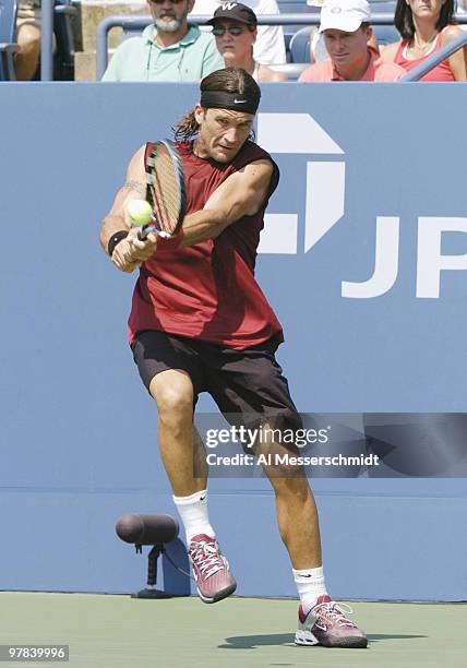 Third-seeded Carlos Moya loses to Olivier Rochus in the third round of the men's singles September 4, 2004 at the 2004 US Open in New York.