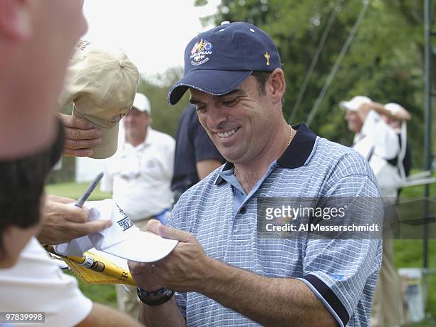 Paul McGinley signs an autograph before play in the 2004 Ryder Cup in Detroit, Michigan, September 16, 2004.