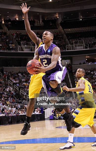 Guard Isaiah Thomas of the Washington Huskies goes up for a shot against the Marquette Golden Eagles during the first round of the 2010 NCAA men's...