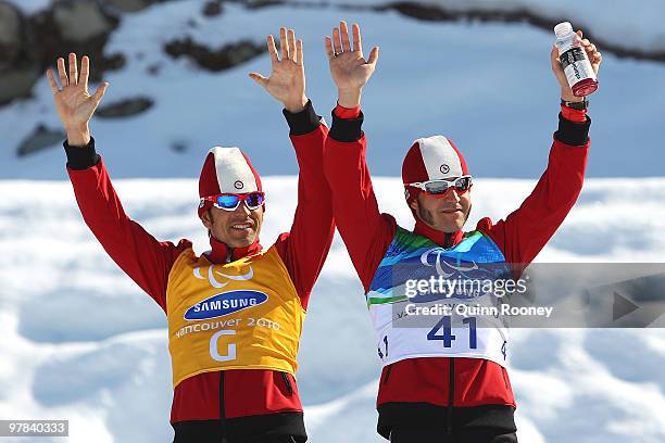 Brian McKeever and guide Robin McKeever of Canada celebrate winning the Men's 10km Visually Impaired Cross-Country Skiing during Day 7 of the 2010...