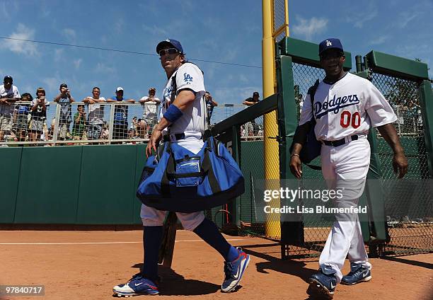 Doug Mientkiewicz and Garet Anderson of the Los Angeles Dodgers walk onto the field for a spring training game against the Chicago Cubs on March 18,...